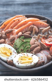 Healthy Bowl With Salmon, Avocado, Egg And Vegs