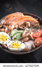 Healthy Bowl With Salmon, Avocado, Egg And Vegs