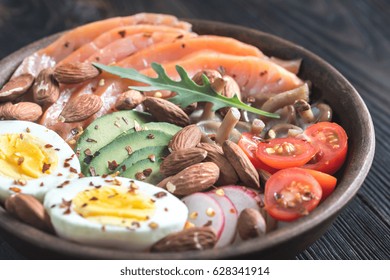 Healthy Bowl With Salmon, Avocado, Egg And Vegs