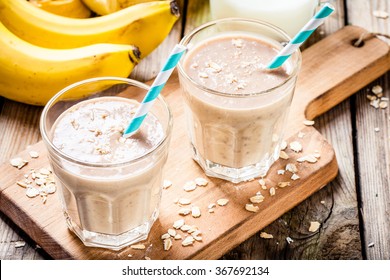 Healthy breakfast: banana smoothie with oatmeal, peanut butter and milk