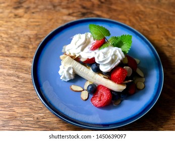 Healthy Breakfast Banana Split On Blue Plate