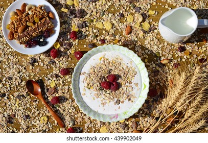 A healthy breakfast with cereal muesli, milk, nuts and berries - Powered by Shutterstock