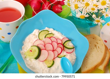 Healthy Breakfast For Child With Bowl Of Cottage Cheese,radish And Cucumber In Fish Shape