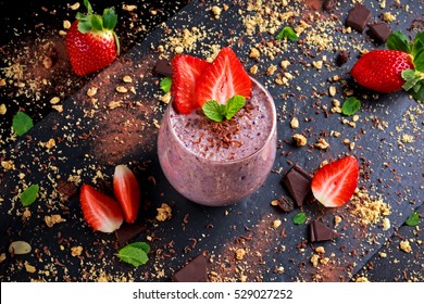 Healthy Breakfast Chocolate, berry and oats Smoothie decorated with strawberry - Powered by Shutterstock