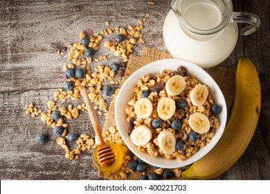 Healthy Breakfast Concept With Oat Flakes And Fresh Berries On Rustic Background. Food Made Of Granola And Musli. Healthy Banana Smoothie With Blackberries, Honey And Milk.