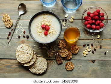 Healthy breakfast. Crispbread, raspberries and honey on the table, wooden background - Powered by Shutterstock