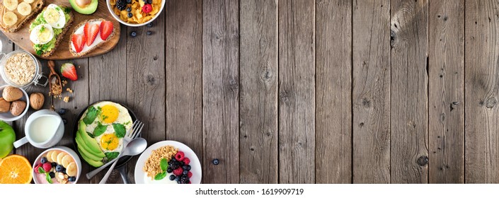 Healthy Breakfast Food Banner With Side Border. Table Scene With Fruit, Yogurt, Smoothie Bowl, Nutritious Toasts, Cereal And Egg Skillet. Top View Over A Rustic Wood Background. Copy Space.