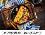 Healthy breakfast food, Stuffed egg omelette with vegetable, dark concrete background copy space top view
