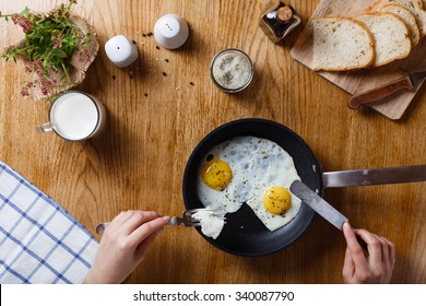 Healthy Breakfast With Fried Eggs In A Frying Pan On A Wooden Table