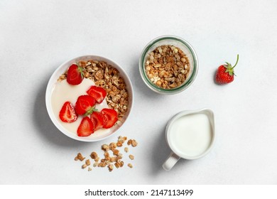healthy breakfast with granola and strawberries. view from above - Shutterstock ID 2147113499