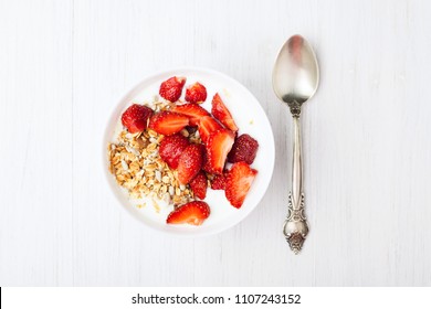 Healthy Breakfast With Granola, Yoghurt And Strawberry. Top View.