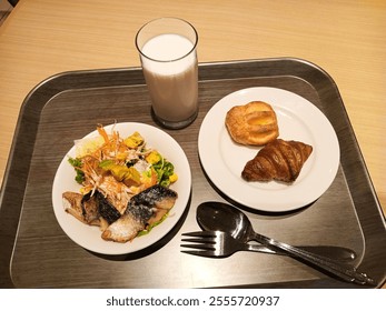 Healthy breakfast: grilled salmon with croissants and fresh milk - Powered by Shutterstock