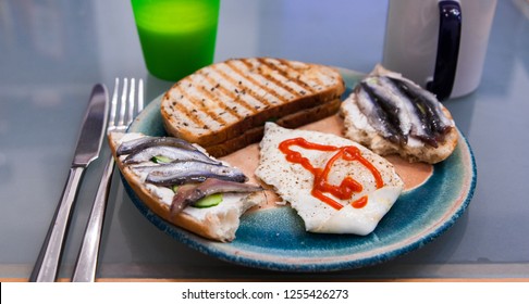 Healthy Breakfast At Home. Herring, Cream Cheese, Egg, Sriracha Sauce, Grilled Toast From Bread With Seeds, Cup Of Coffee, Yoghurt