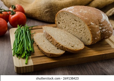 Healthy breakfast - homemade beer bread with cheese, tomatoes and chives - Powered by Shutterstock