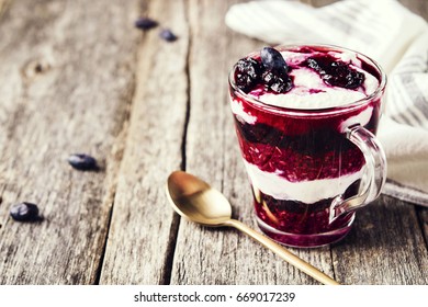 Healthy Breakfast: Honeysuckle Jam, Granola And Cottage Cheese Parfait On Rustic Wooden Background. Selective Focus  