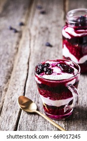 Healthy Breakfast: Honeysuckle Jam, Granola And Cottage Cheese Parfait On Rustic Wooden Background. Selective Focus  