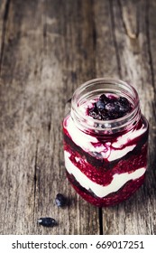 Healthy Breakfast: Honeysuckle Jam, Granola And Cottage Cheese Parfait On Rustic Wooden Background. Selective Focus  