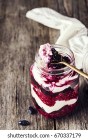 Healthy Breakfast: Honeysuckle Jam, Granola And Cottage Cheese Parfait On Rustic Wooden Background. Selective Focus 