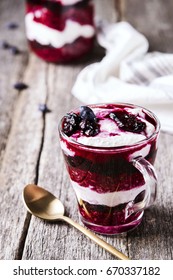 Healthy Breakfast: Honeysuckle Jam, Granola And Cottage Cheese Parfait On Rustic Wooden Background. Selective Focus 