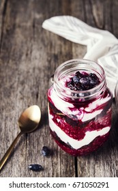 Healthy Breakfast: Honeysuckle Jam, Granola And Cottage Cheese Parfait On Rustic Wooden Background. Selective Focus 