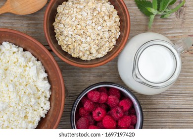 Healthy Breakfast Items. Oatmeal, Milk, Fresh Berries And Cottage Cheese. Overhead View, Rustic Style