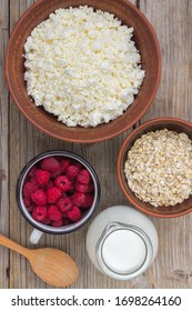 Healthy Breakfast Items. Oatmeal, Milk, Fresh Berries And Cottage Cheese. Overhead View, Rustic Style