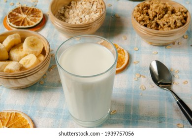 Healthy breakfast - milk with muesli and banana - health and diet concept - Powered by Shutterstock