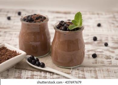 Healthy breakfast or morning snack with chia seeds chocolate pudding and blueberries. vegetarian food, diet and health concept.