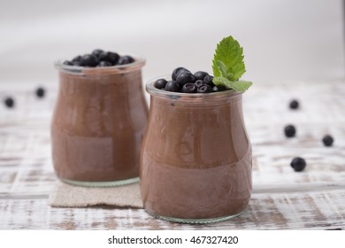 Healthy breakfast or morning snack with chia seeds chocolate pudding and blueberries. vegetarian food, diet and health concept. - Powered by Shutterstock