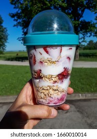 Healthy Breakfast Overnight Oats With Strawberries, Blueberries And In A Plastic Container With Beautiful Outdoor Background - Food Prep And Meal Prep Concept