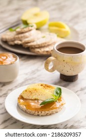 Healthy Breakfast. Round Buckwheat And Rice Cake With Almond Butter And Apple Decorated With Cinnamon And Basil