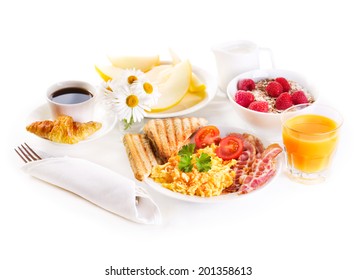 Healthy Breakfast With Scrambled Eggs, Juice And Fruits On White Background