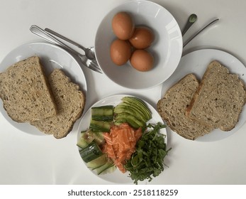 healthy breakfast served whole meal bread eggs salmon avocado cucumber arugula - Powered by Shutterstock