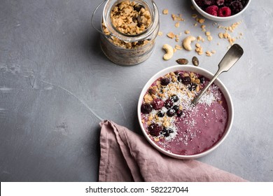 Healthy Breakfast Smoothie Bowl With Fresh Berries And Home Made Granola; Overhead View