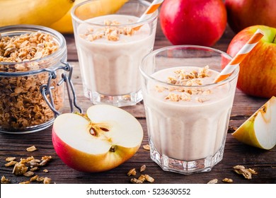 Healthy Breakfast: Smoothie With Granola, Red Apple And  Banana On Wooden Background