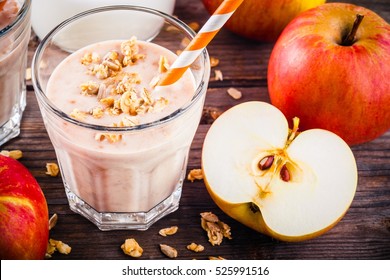 Healthy Breakfast: Smoothie With Granola, Red Apple And Yogurt On Wooden Background