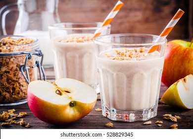 Healthy Breakfast: Smoothie With Granola, Red Apple And Milk On Wooden Background