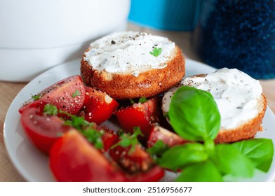 Healthy Breakfast tomato salad, muffins with cream cheese and herbs - Powered by Shutterstock