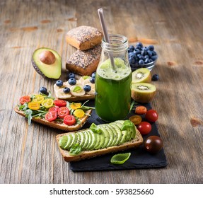 Healthy breakfast with vegan sandwiches and green smoothie, vitamin, vegetarian and diet food - Powered by Shutterstock