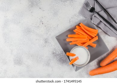 Healthy Breakfast With Yogurt And Carrot Sticks. Diet And Healthy Snack Food. Top View