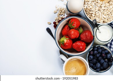 Healthy breakfast - yogurt with muesli and berries - health and diet concept - Shutterstock ID 192051983