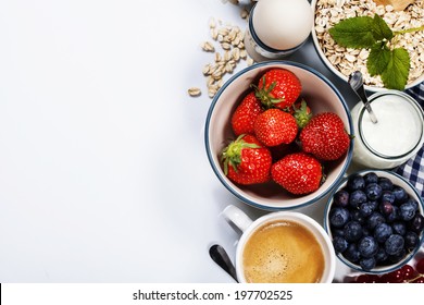Healthy breakfast - yogurt with muesli and berries - health and diet concept - Shutterstock ID 197702525