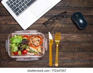 Healthy Business Lunch At Workplace. Vegetables And Fried Chicken Lunch Box On Working Desk With Laptop And Glasses.