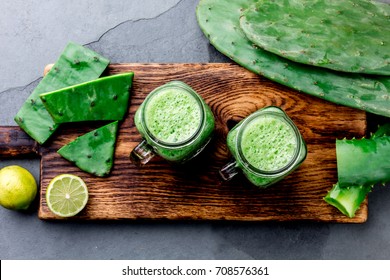 Healthy cactus nopales, aloe vera and lemon drink smoothie and ingredients on gray background. Top view. - Powered by Shutterstock