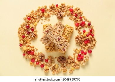 Healthy Cereal Bars And Cranberries On Color Background