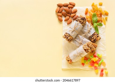 Healthy Cereal Bars, Raisins And Nuts On Color Background