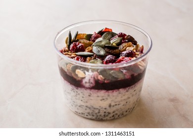 Healthy Chia Pudding Yogurt With Pumpkin Seeds And Granola / Acai Bowl In Plastic Cup. Organic Dessert.