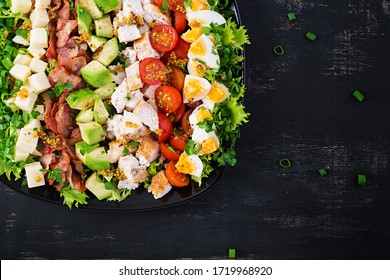 Healthy Cobb Salad With Chicken, Avocado, Bacon, Tomato, Cheese And Eggs. American Food. Top View. Flat Lay, Overhead