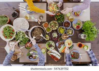 Healthy and colorful diet meal with friends, top view - Shutterstock ID 547639702