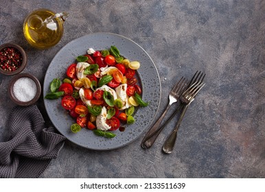 healthy colorful tomato mozzarella basil salad with balsamic vinegar dressing